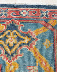Comfortable Celia Blue Hand Knotted Wool Rug, a calming azure wool rug featuring a subtly textured, hand-knotted design, lending tranquil elegance to a bright, airy room.