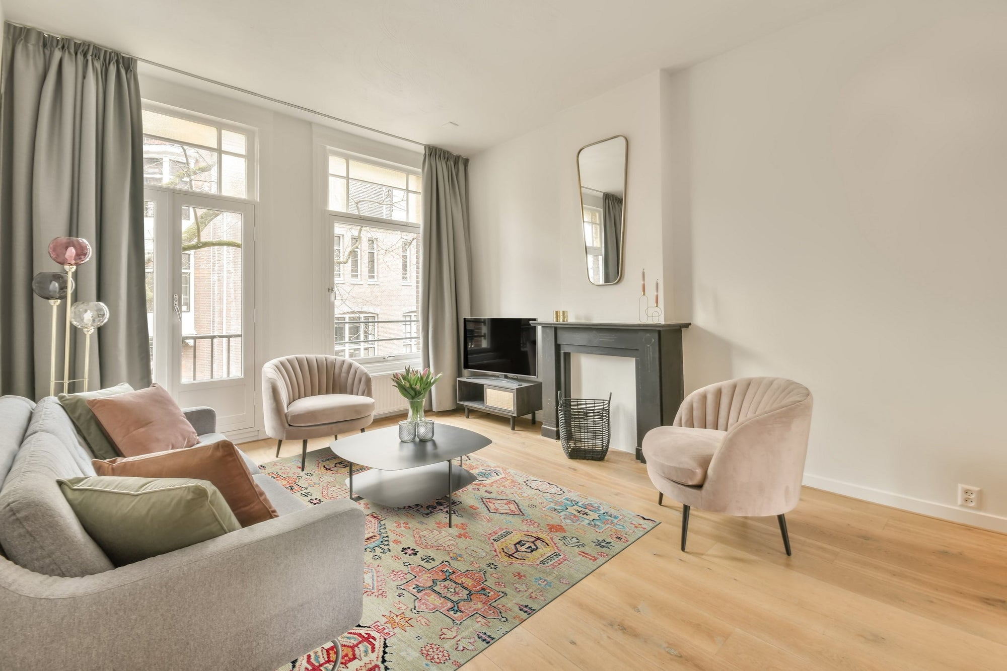 Lush Oriental Ivory Hand Knotted Wool Rug displayed in a bright living room setting. The ivory wool rug, showcasing its intricate oriental design, anchors a space with light-colored furniture and hardwood floors.