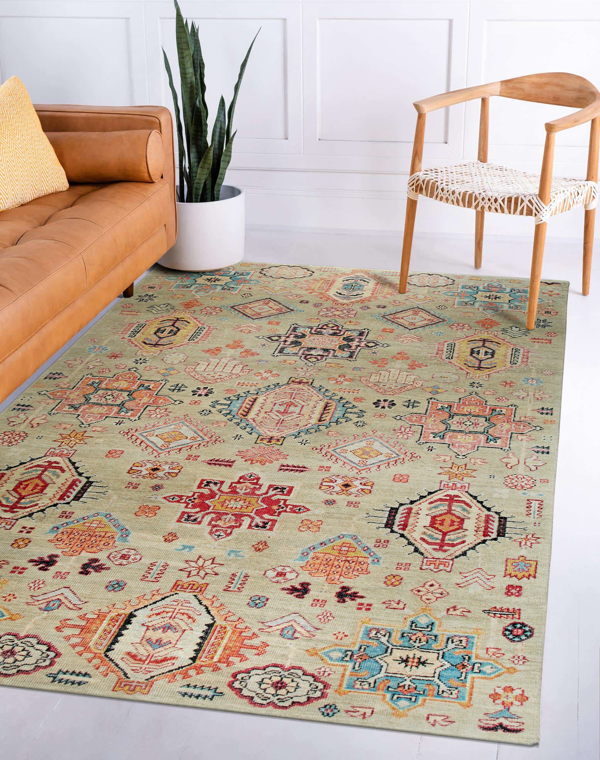 Lush Oriental Ivory Hand Knotted Wool Rug displayed in a bright, airy living room, its intricate ivory patterns softly contrasting against a light hardwood floor and complementing neutral-toned furniture. The rug's hand-knotted wool construction adds a layer of plush texture to the scene.