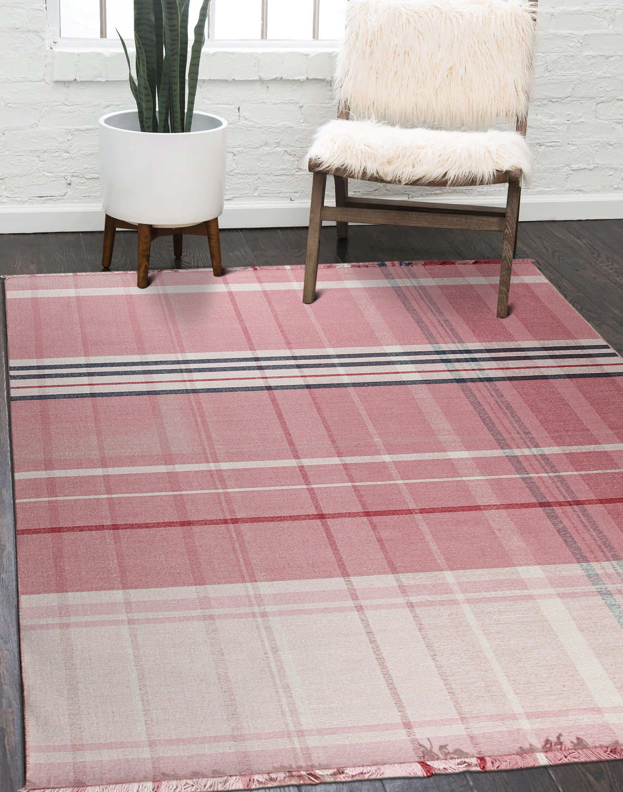 Maya Giselle Pink Flatweave Wool Rug, a delicate rose-hued wool rug with a subtly textured flatweave, adding warmth and understated elegance to a light-filled living space.