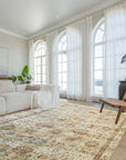 Versatile Agra Beige Hand Knotted Wool Rug displayed in a living room setting; light beige tones and intricate traditional patterns enrich the space's neutral palette.