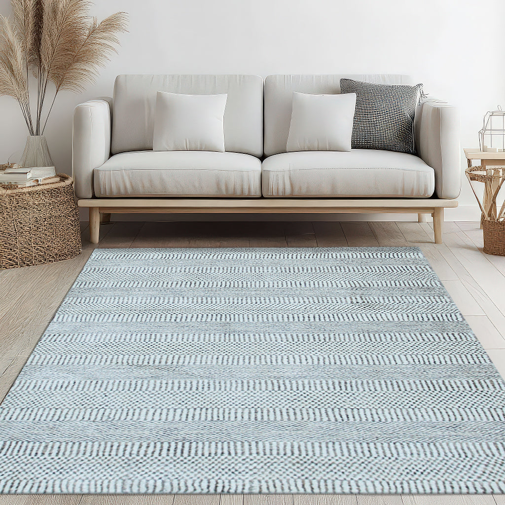 Trendy Dahlia Beige Handmade Wool Rug, showcased in a bright living room setting. Creamy beige tones and textured wool create a warm, inviting space.