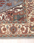 Amara Ruby Blue Hand Knotted Wool Rug, vibrant ruby and cool blue tones dance across hand-knotted wool, adding warmth and artistry to a softly lit interior space.