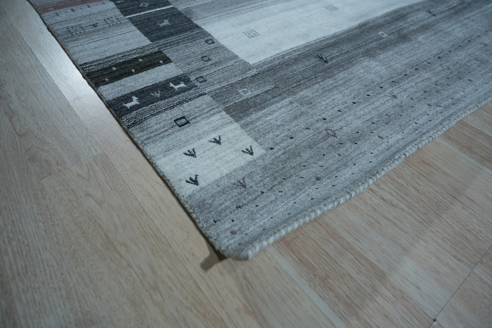 Sophie Gabbeh Gray Handmade Wool Rug, a gray wool rug with a simple, textured design, offering subtle warmth and comfort.
