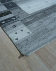 Sophie Gabbeh Gray Handmade Wool Rug, a gray wool rug with a simple, textured design, offering subtle warmth and comfort.