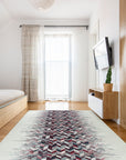 Brenda Refined Multicolor Flatweave Wool Rug showcased in a bright living room setting. Woven wool threads create a vibrant, flatweave design with an array of blended colors.