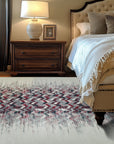 Brenda Refined Multicolor Flatweave Wool Rug, seen in a bright, sunlit living room, its flatweave construction showcasing vibrant hues and refined patterns, anchoring a modern seating arrangement.