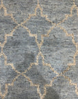 Versatile Agra Blue Hand Knotted Wool Rug, showcasing a detailed, traditional pattern in shades of blue against a lighter backdrop, possibly wool, with intricate knotwork indicating hand-knotted construction, seen in a product-focused setting.