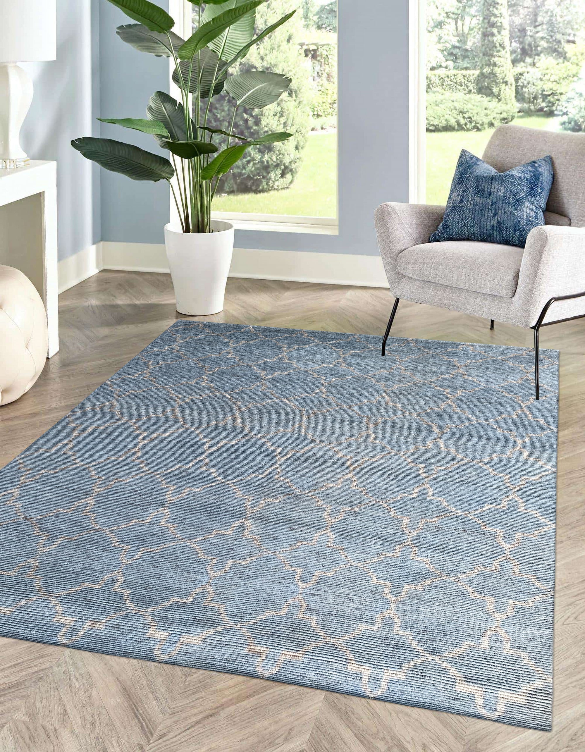 Versatile Agra Blue Hand Knotted Wool Rug, showcasing intricate floral patterns in shades of blue and cream against a subtle blue background, adding an elegant touch to a neutral-toned living space.