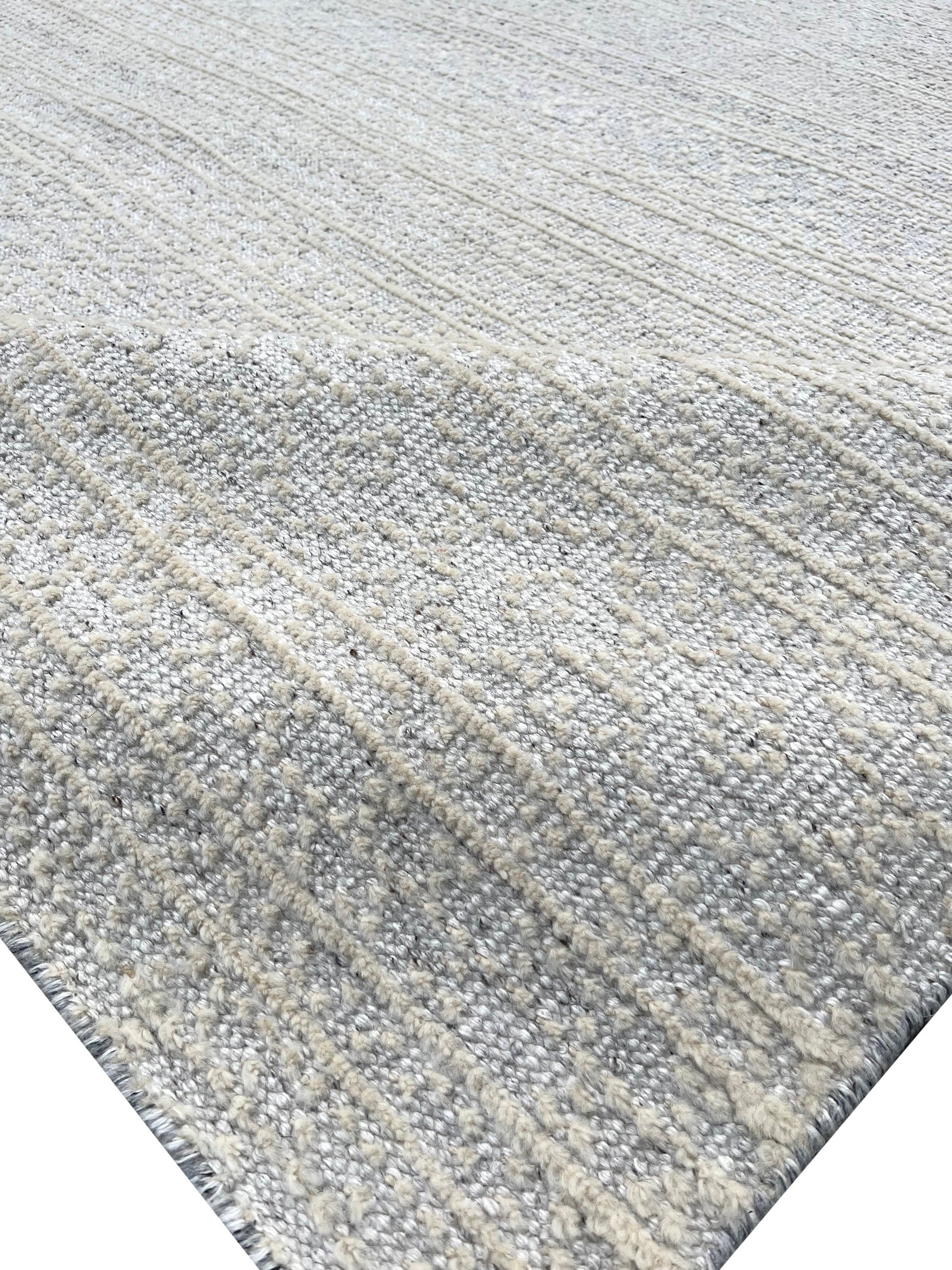 Bianca Louie Ivory Handmade Wool Rug, soft ivory tones and subtle textures meet in this handcrafted wool rug, evoking a sense of understated elegance in a modern living space.