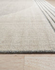 Majestic Chic Charcoal Handmade Wool Rug, featuring subtle variations in tone across its charcoal wool surface, creates a sophisticated and versatile foundation for any room.