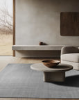 Majestic Chic Charcoal Handmade Wool Rug, deep charcoal textures and subtle patterns blend seamlessly in this wool rug, adding warmth and sophistication to a living space.