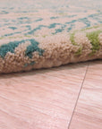 Beautiful Alluring Green Hand Tufted Wool Rug, a lush emerald expanse lending warmth and texture to a modern living space with light wood floors and minimalist furniture.