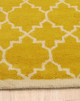 Enchanting Vibrant Yellow Hand Tufted Wool Rug, a bright yellow wool rug with a dense, plush texture, seen styled in a living room setting with modern furniture.