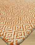 Beautiful Trellis Orange Hand Tufted Wool Rug, warm orange hand-tufted wool creation featuring a crisp trellis pattern, enriching a bright, modern living space.