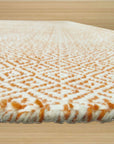 Beautiful Trellis Orange Hand Tufted Wool Rug, a vibrant orange hand-tufted wool rug with a classic trellis design, complements a modern living space.