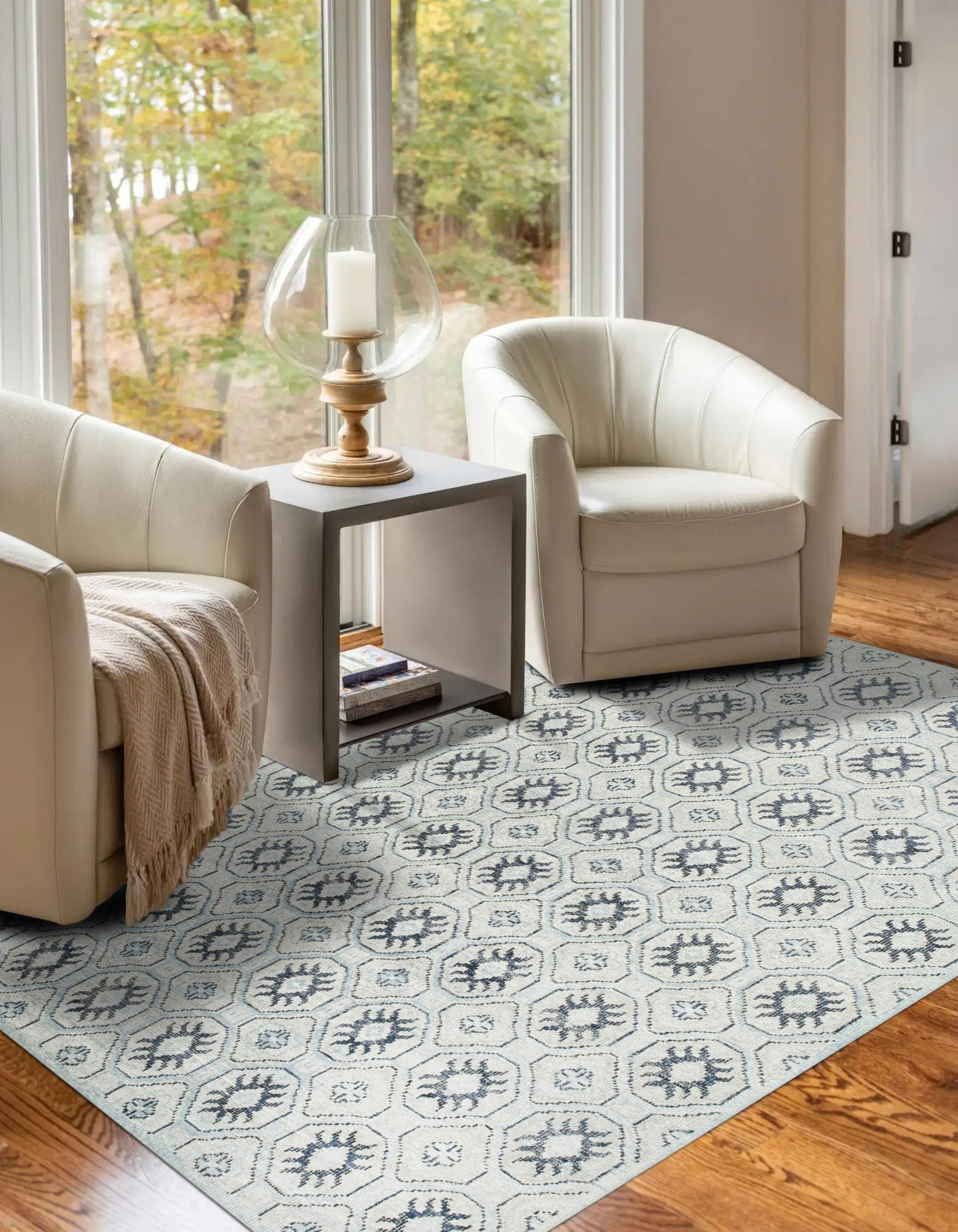 Para Giselle Blue Hand Knotted Rug, showcasing intricate, hand-knotted patterns in shades of blue and cream, creating a sophisticated and inviting atmosphere in a modern living space.