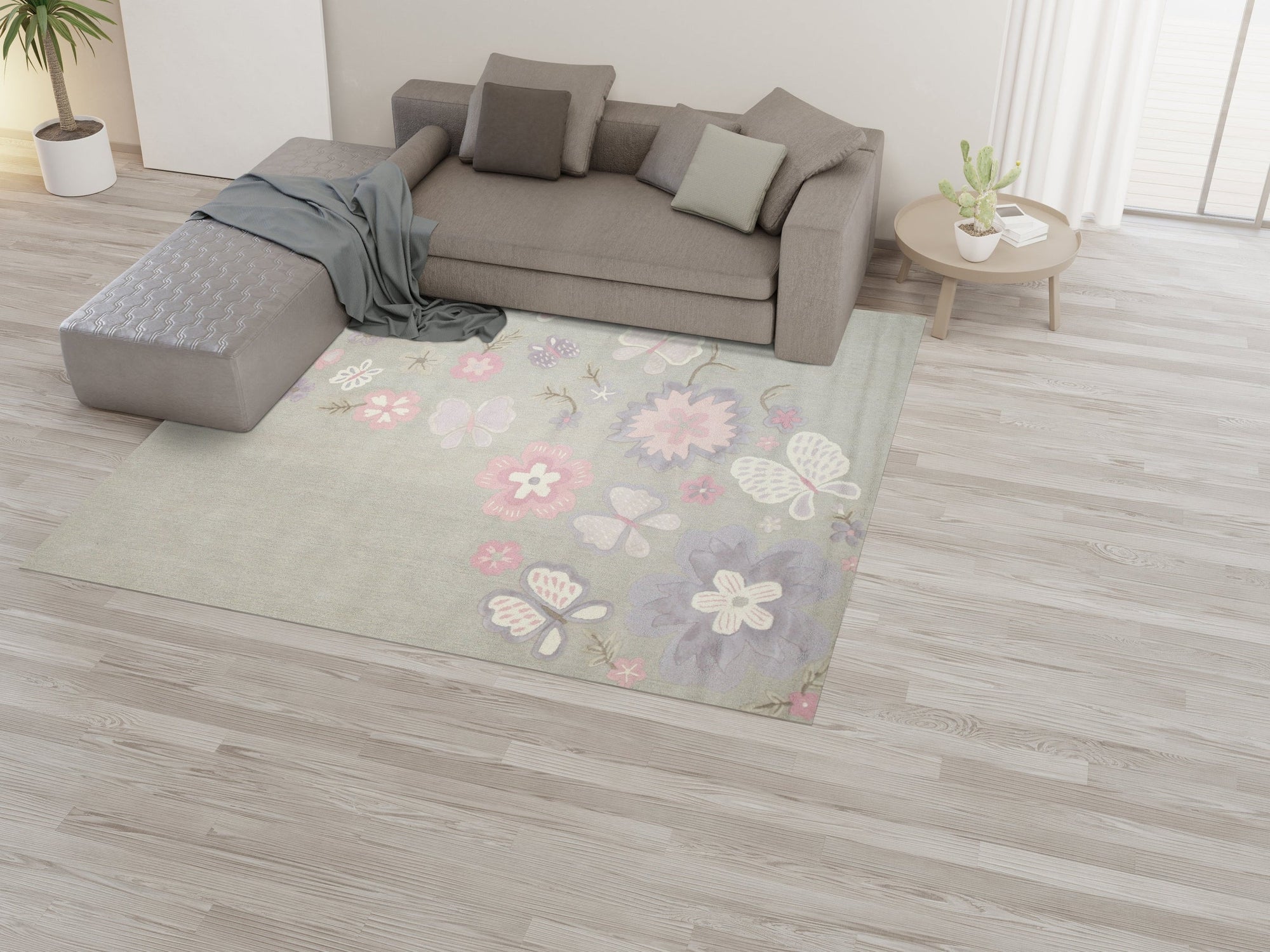 Rustic Elena Gray Hand Tufted Wool Rug, its subtle gray tones and textured wool surface lending warmth to a modern living room with light wood floors and minimalist furnishings.