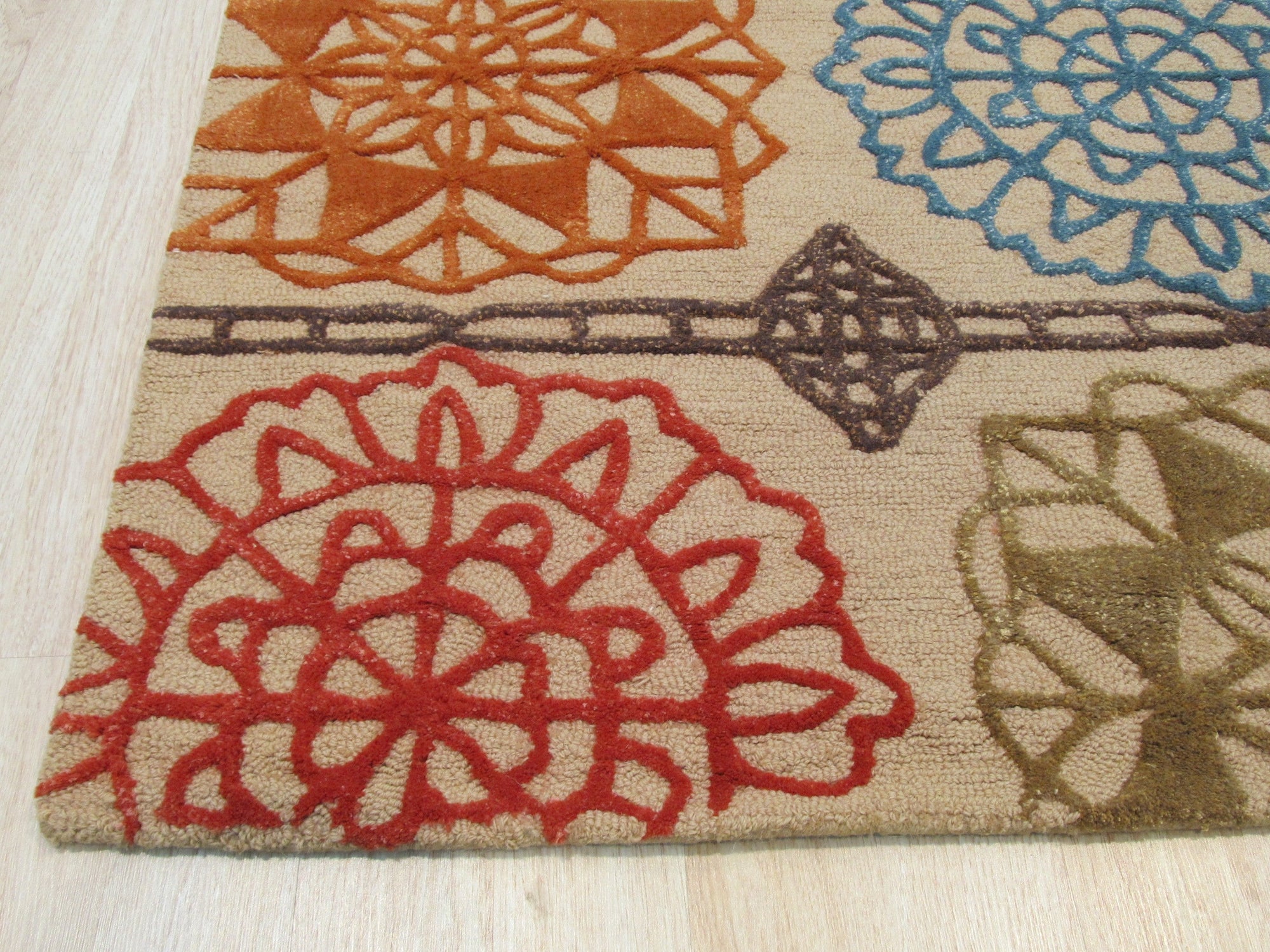 Artistic Sumptuous Beige Hand Tufted Wool Rug, soft beige wool underfoot with a subtle, textured pattern, adding warmth to a comfortably furnished living room.