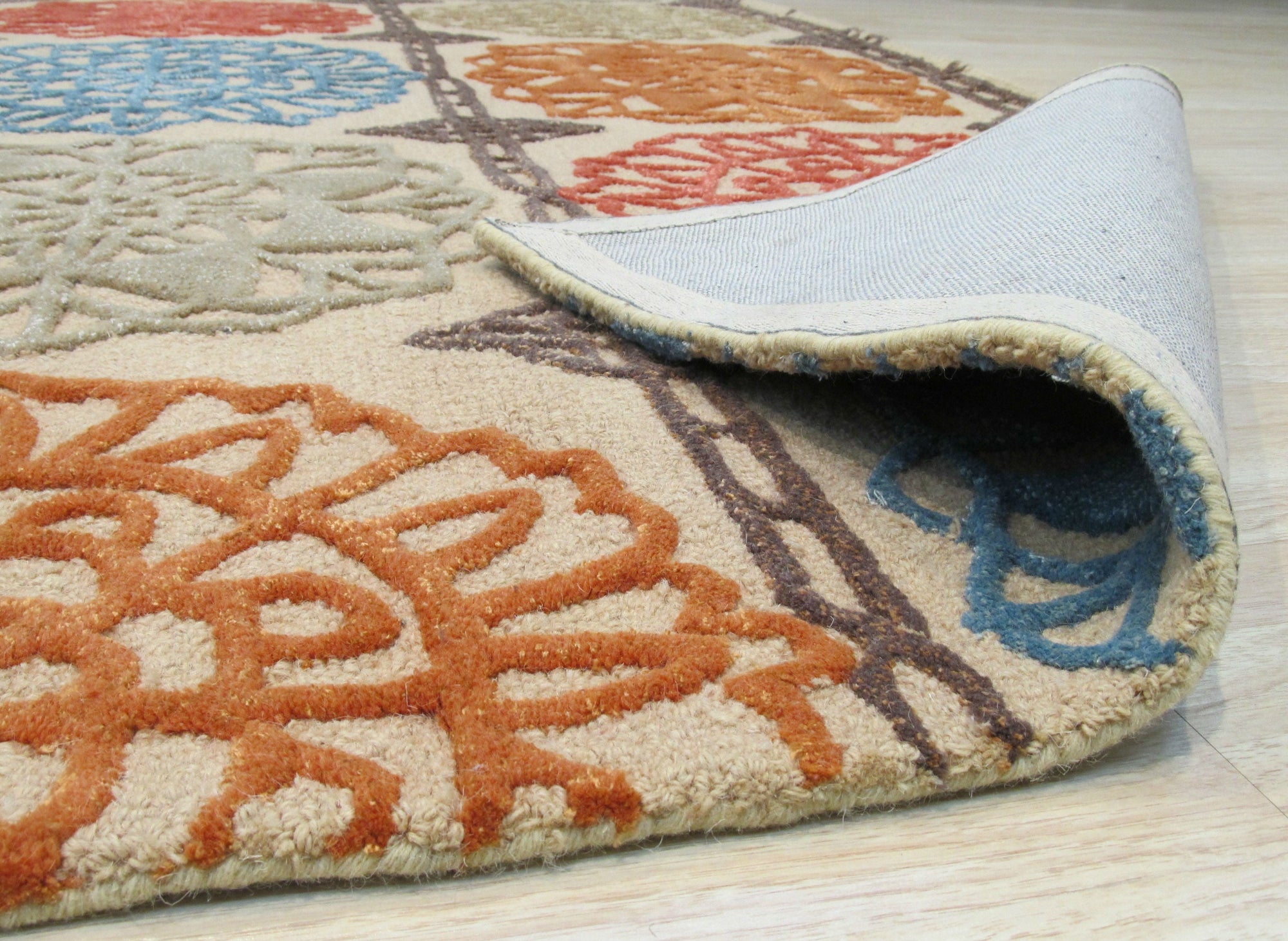 Artistic Sumptuous Beige Hand Tufted Wool Rug, its soft beige tones and hand-tufted texture adding warmth to a modern living space.