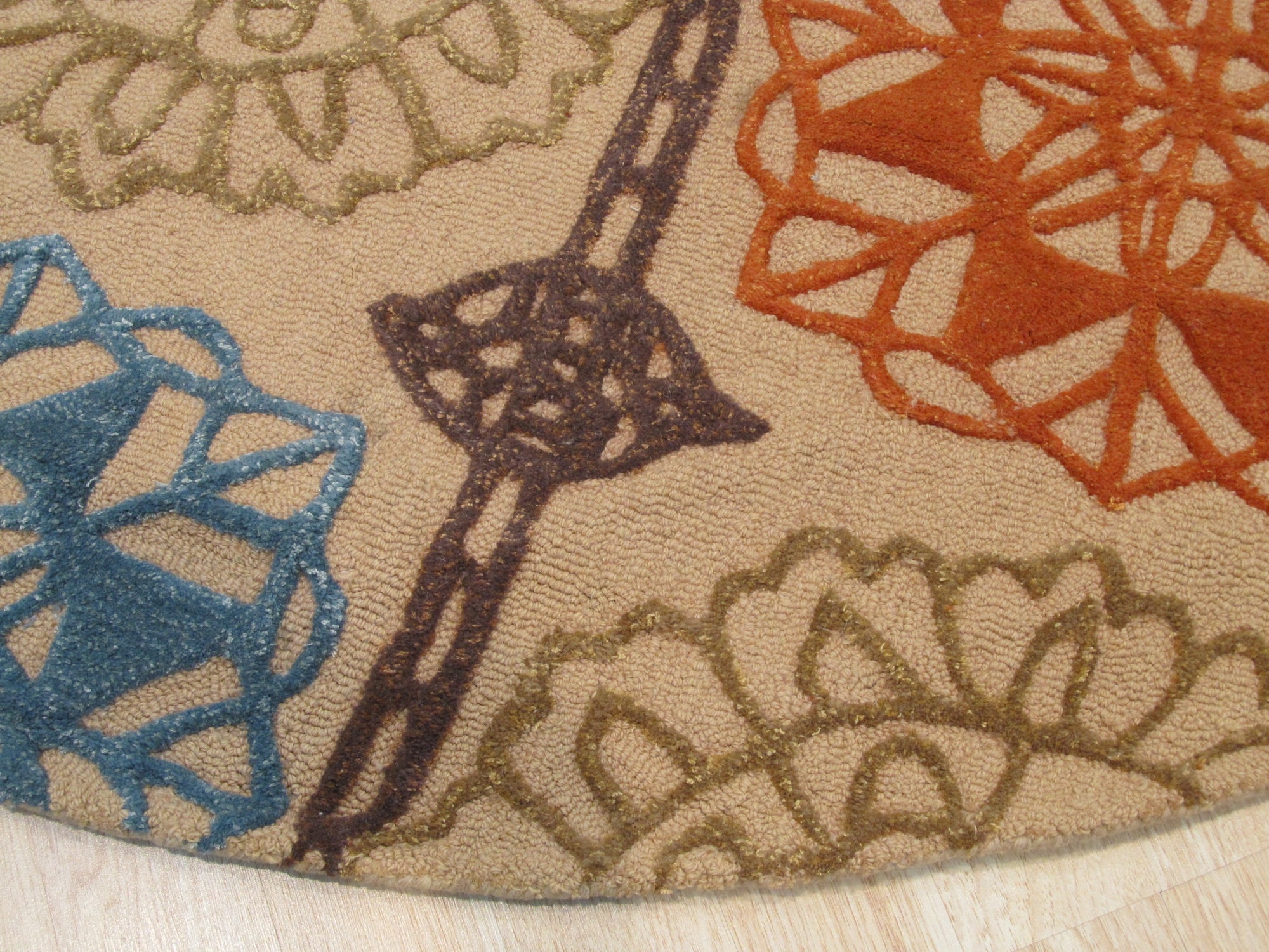 Artistic Sumptuous Beige Hand Tufted Wool Rug, featuring a soft beige palette and plush hand-tufted wool construction, graces a contemporary living space.