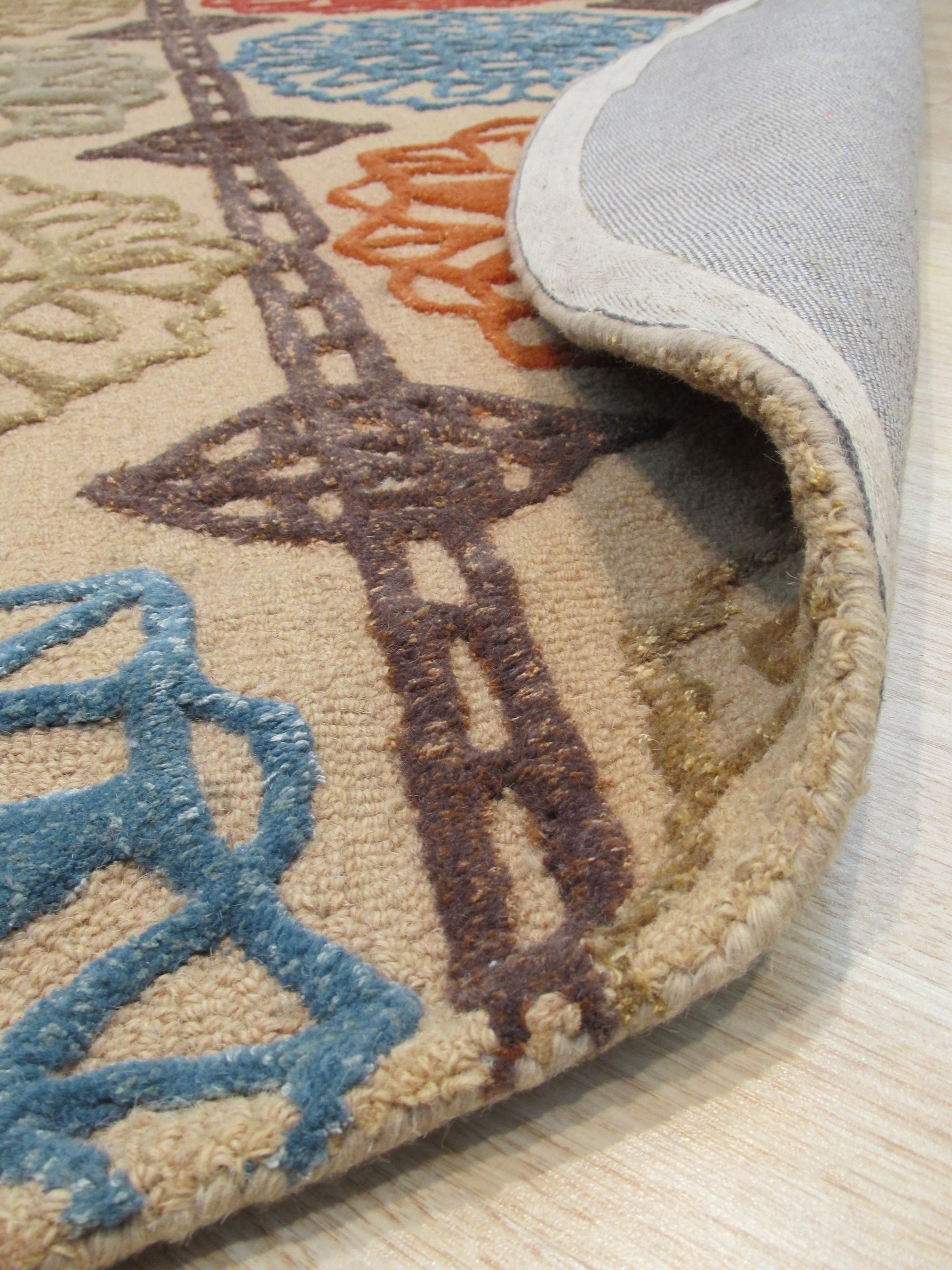 Artistic Sumptuous Beige Hand Tufted Wool Rug, showcasing a soft, inviting texture and warm beige tones in a living room setting, complementing neutral furniture and creating a cozy atmosphere.