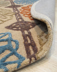 Artistic Sumptuous Beige Hand Tufted Wool Rug, showcasing a soft, inviting texture and warm beige tones in a living room setting, complementing neutral furniture and creating a cozy atmosphere.