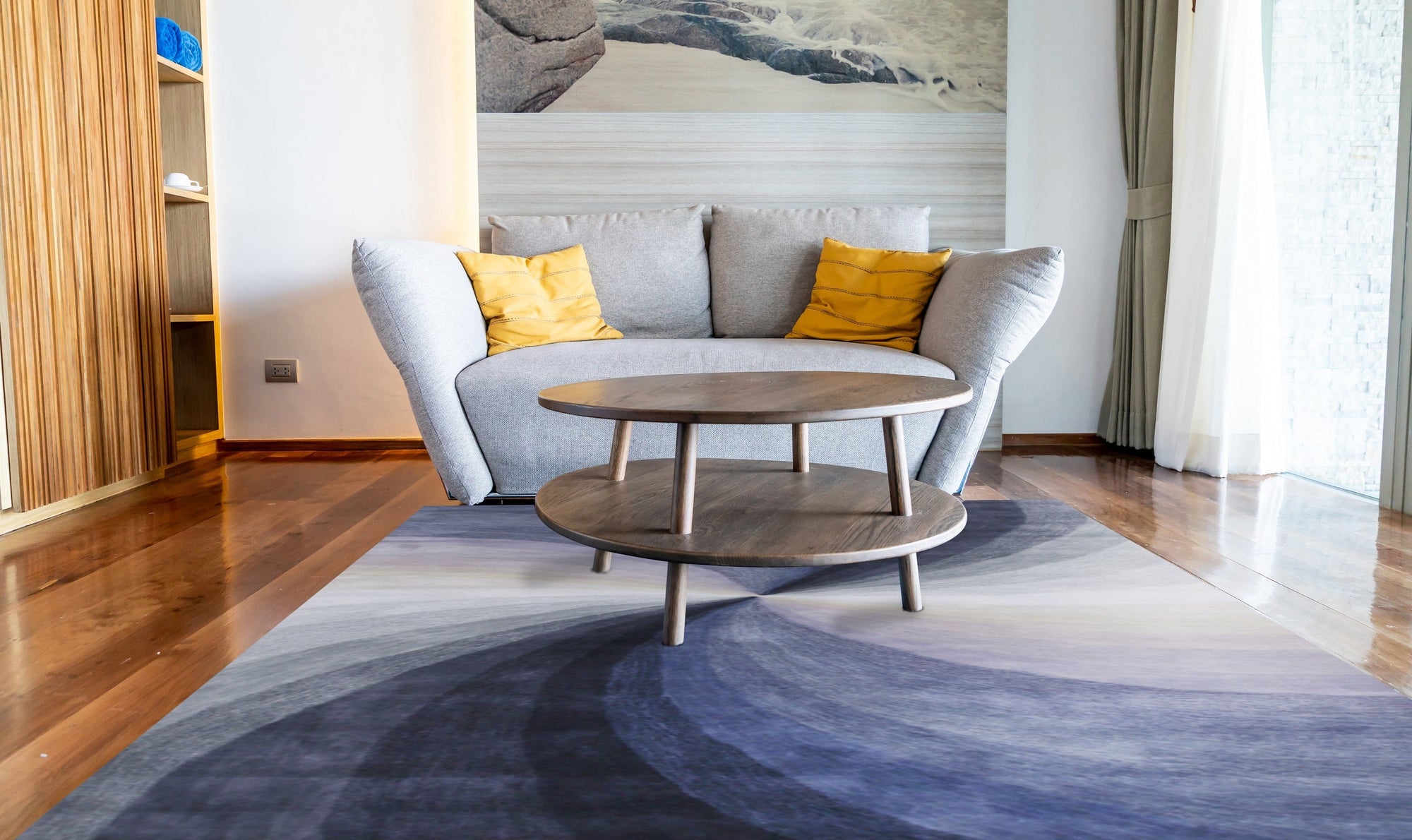 Stylish Timeless Blue Hand Tufted Wool Rug, featuring a classic design in shades of blue and cream, positioned on a light hardwood floor creating a warm and inviting space.