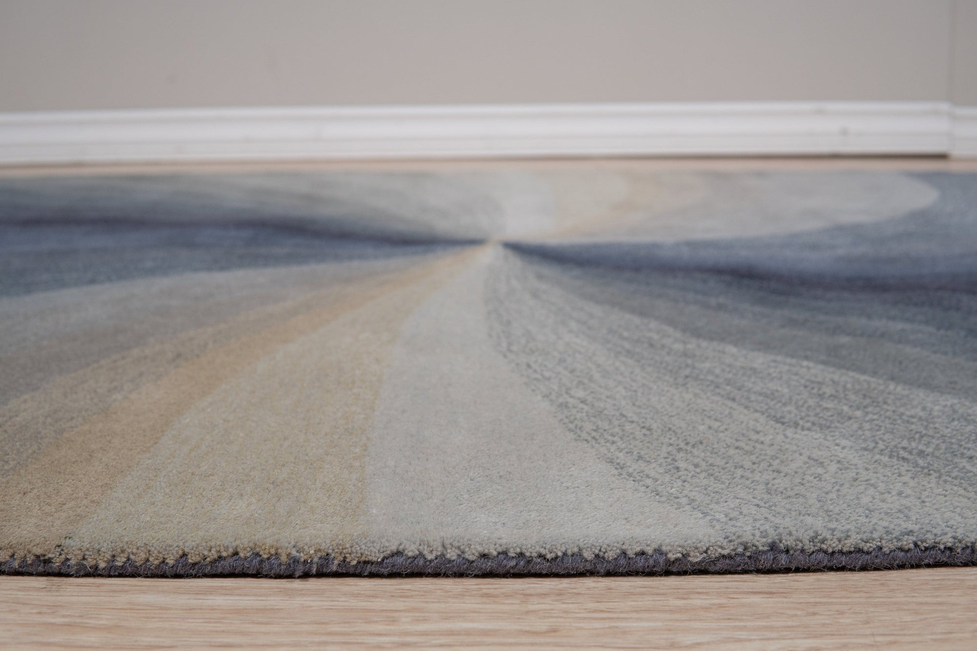 Stylish Timeless Blue Hand Tufted Wool Rug, anchoring a bright living room with its rich blue tones and textured wool construction, complemented by modern furniture.