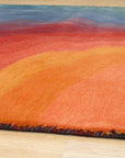 Talia Classic Rainbow Hand Tufted Wool Rug, vibrant waves of color arch across a plush wool surface, hand-tufted for a luxuriously textured feel, displayed amidst soft, natural lighting.