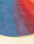 Talia Classic Rainbow Hand Tufted Wool Rug, vibrant arc of rainbow hues radiating across a plush, hand-tufted wool pile, illuminating a cozy interior setting.