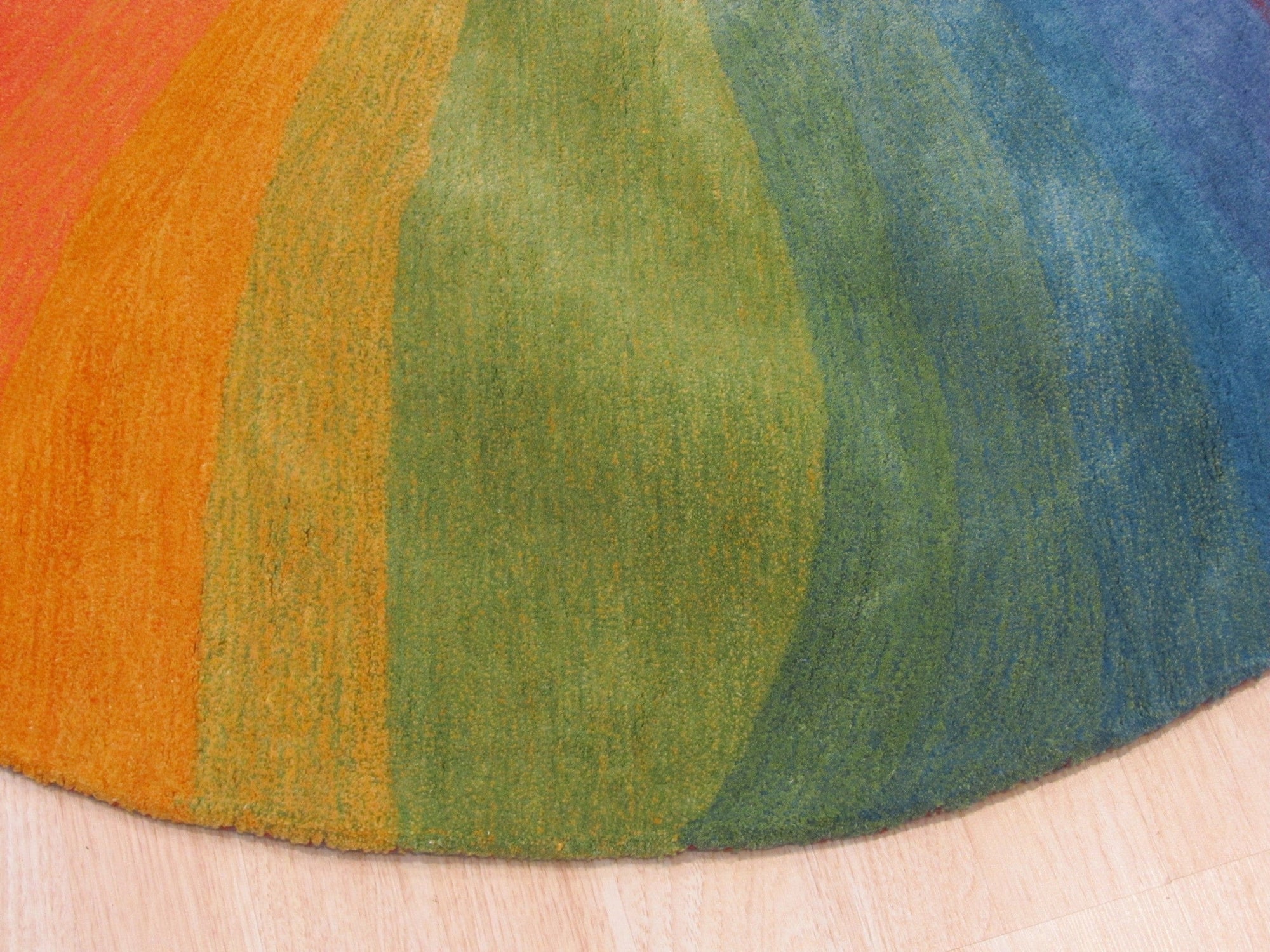 Vibrant Dazzling Multicolor Hand Tufted Wool Rug, a kaleidoscope of colors and textures, hand-tufted in wool, lying flat with details showcased in natural light, revealing its intricate patterns.