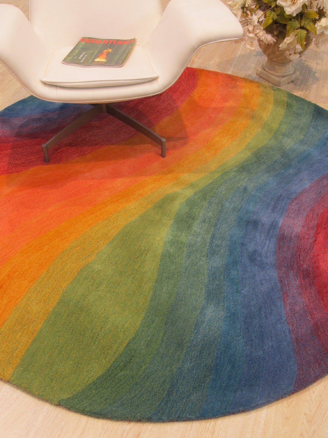 Vibrant Dazzling Multicolor Hand Tufted Wool Rug, a burst of color and texture, sprawls across the floor, showcasing intricate hand-tufted details.