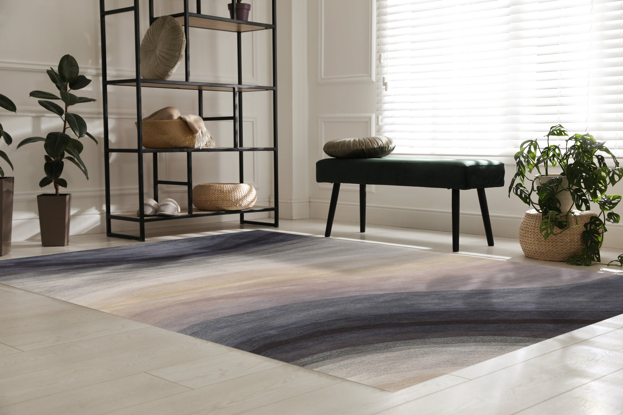 Xena Violet Blue Hand Tufted Wool Rug displayed on a light hardwood floor, its violet and blue hues creating a soothing and sophisticated palette. The rug's hand-tufted construction adds texture and depth to its design, complementing the room's warm, inviting atmosphere.