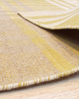 Chic Serene Yellow Flatweave Wool Rug, brightening a modern living space with its subtle yellow tones and flatweave texture.