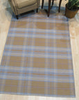 Sarrah Delicate Gold Flatweave Wool Rug, a sophisticated detail shot reveals the rug's intricate flatweave construction and subtle gold tones, showcasing its texture and delicate design.