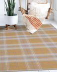 Sarrah Delicate Gold Flatweave Wool Rug, a subtle gold flatweave wool rug with a delicate, neutral design, enriching a light-filled living space.