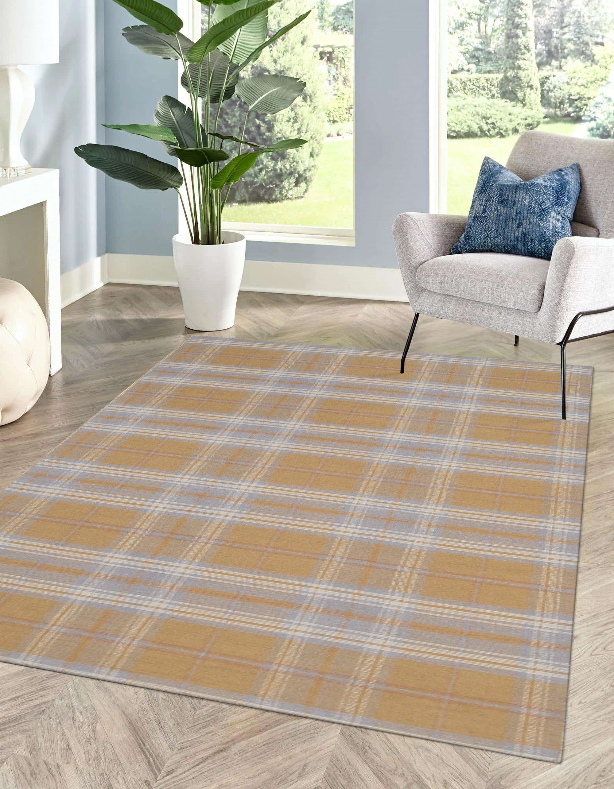 Sarrah Delicate Gold Flatweave Wool Rug, showcasing a subtle golden hue and intricate flatweave construction, displayed in a bright, minimalist living room setting.