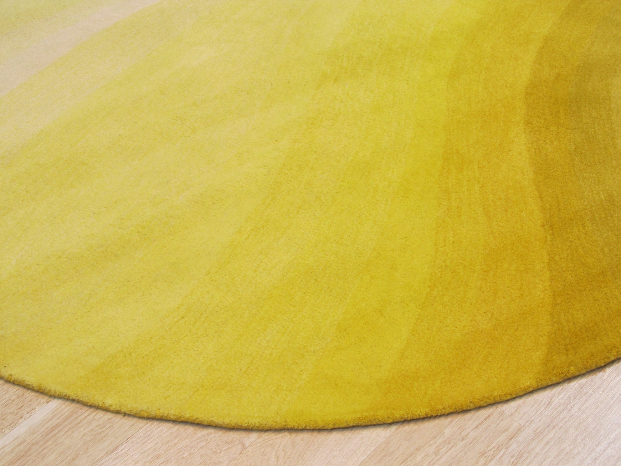 Inviting Ruby Yellow Hand Tufted Wool Rug, displaying vibrant ruby and yellow hues in a handcrafted wool construction, set against a neutral backdrop.