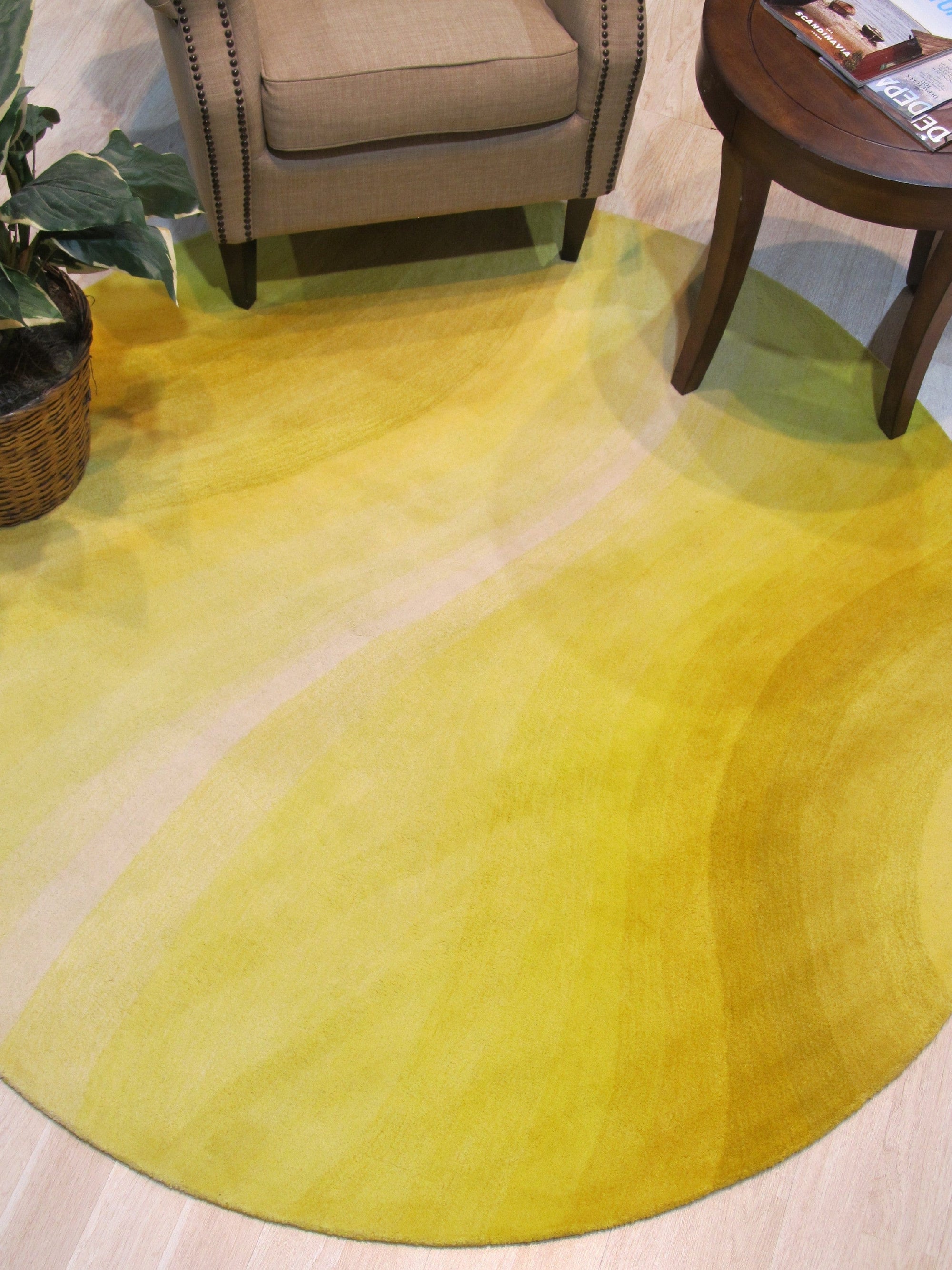Inviting Ruby Yellow Hand Tufted Wool Rug, vibrant ruby and yellow hues swirl across a plush, hand-tufted wool rug, adding warmth and texture to a stylish living space.