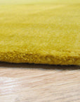 Inviting Ruby Yellow Hand Tufted Wool Rug, vibrant yellow and ruby accents swirl in a hand-tufted wool rug, lending warmth and texture to a modern living space.