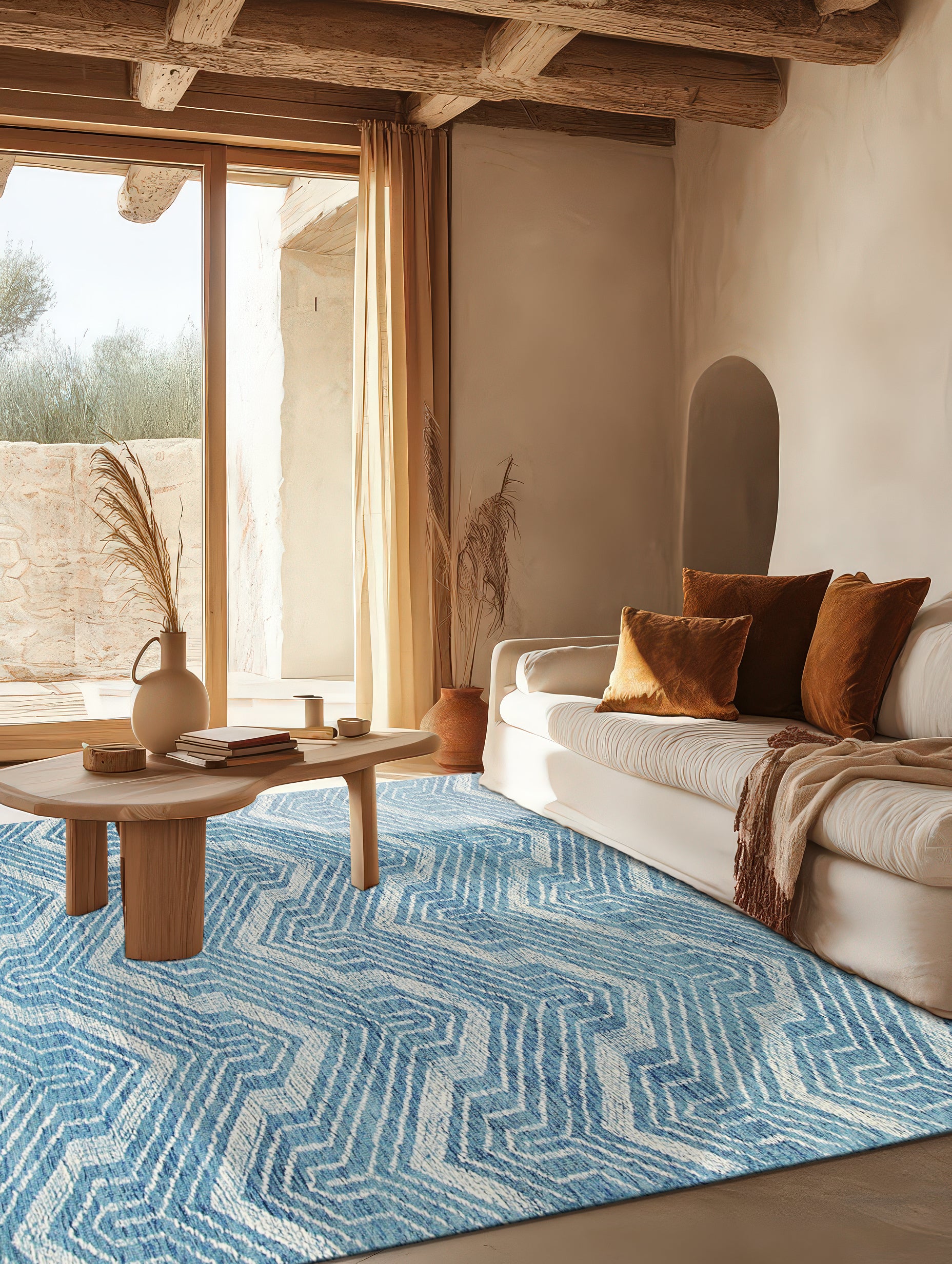 Lila Dahlia Blue Hand Tufted Wool Rug, soft blue wool rug featuring a dahlia-inspired floral pattern, adds a touch of elegance to a bright living space.