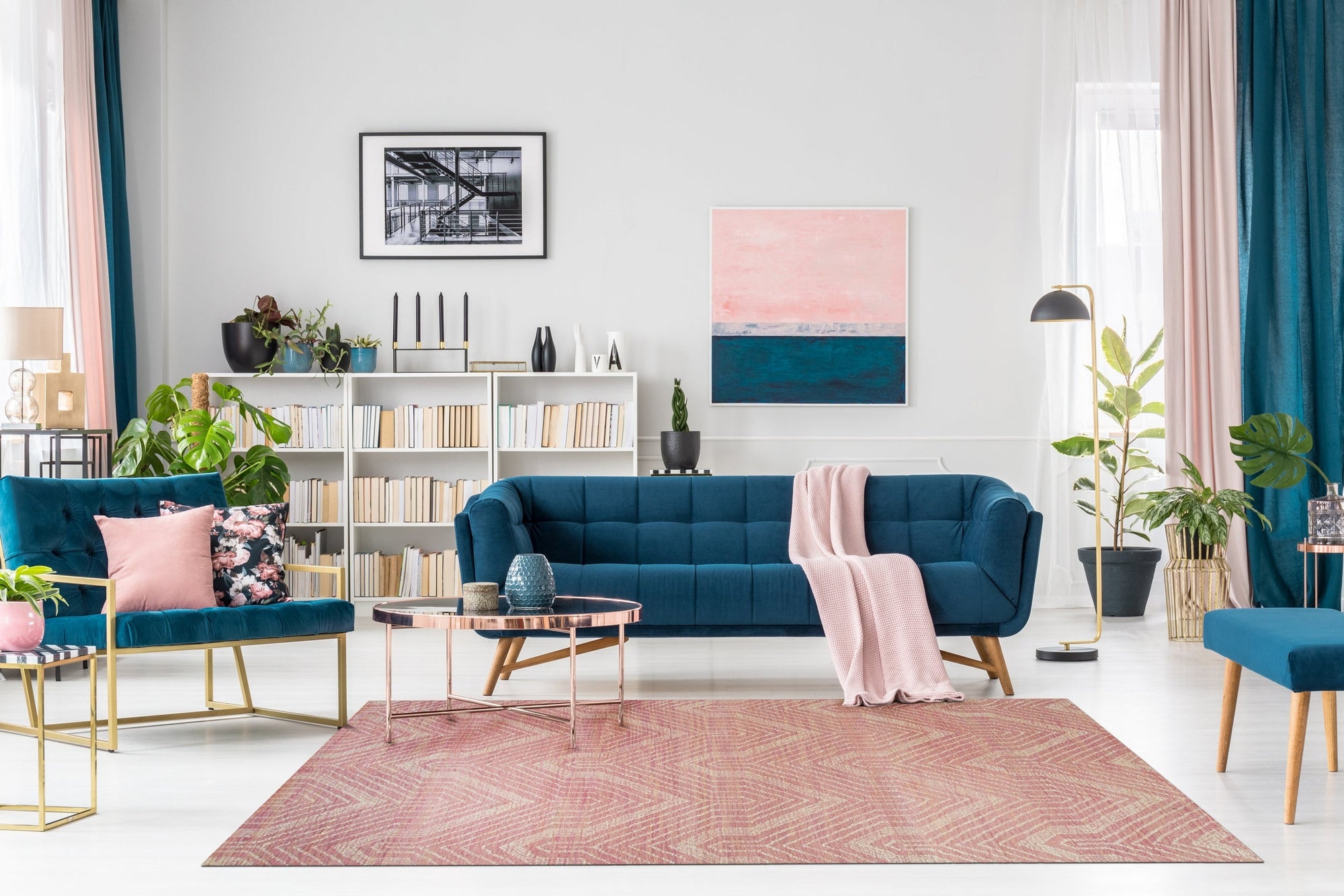 Maya Lush Pink Hand Tufted Wool Rug, a soft, blush-pink rug featuring a subtle, plush texture, anchors a bright and airy living space.