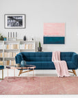 Maya Lush Pink Hand Tufted Wool Rug, a soft, blush-pink rug featuring a subtle, plush texture, anchors a bright and airy living space.