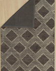 Xena Ava Charcoal Hand Tufted Wool Rug, a deep charcoal wool rug with a subtly textured hand-tufted design, enhancing a modern living room.
