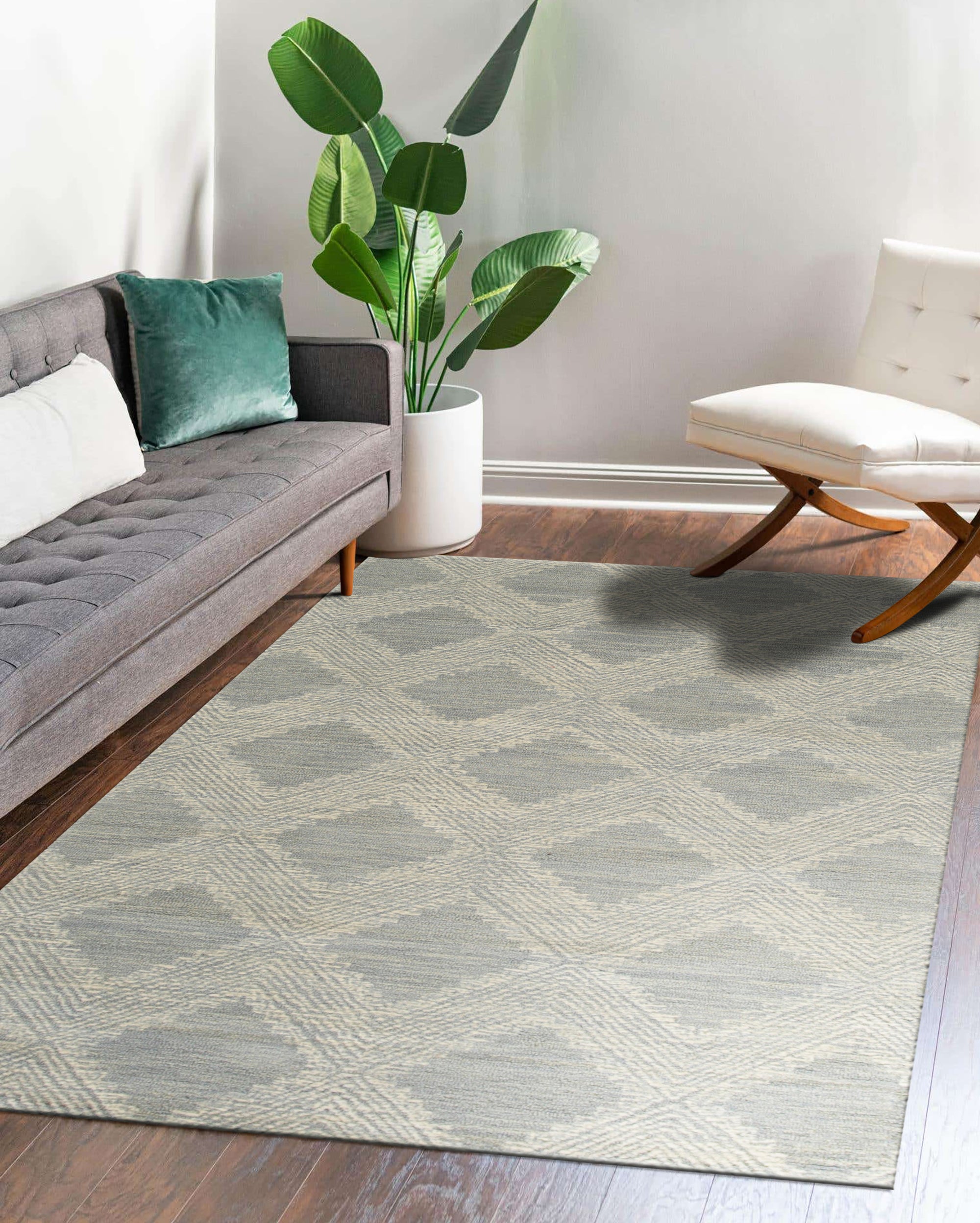 Chloe Quinn Light Blue Hand Tufted Wool Rug, a soft light blue wool rug with subtle variations in texture and color, seen in a bright, inviting living room setting.