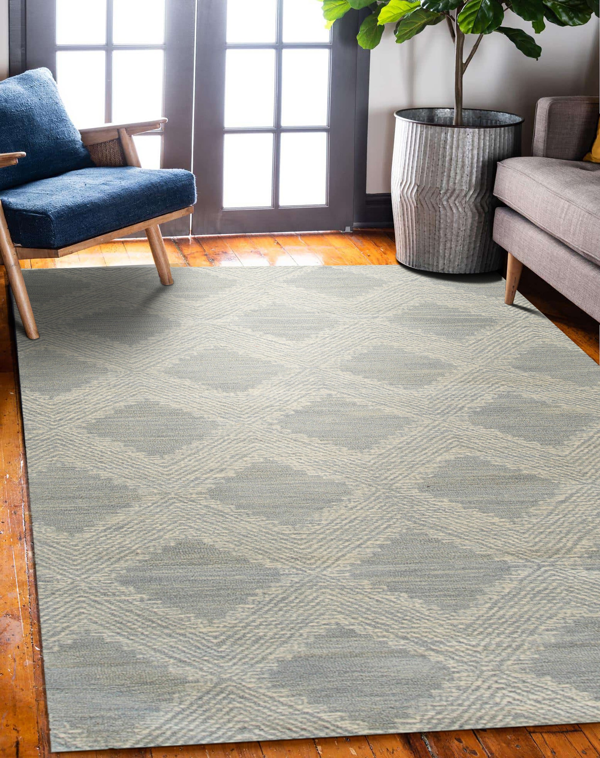 Chloe Quinn Light Blue Hand Tufted Wool Rug, soft light blue wool underfoot, hand-tufted texture inviting warmth into a modern living space with bright, natural light.