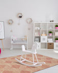 Unique Sloane Pink Hand Tufted Wool Rug, blush pink tones wash across a densely tufted wool texture, seen enhancing a light-filled room.