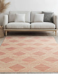 Unique Sloane Pink Hand Tufted Wool Rug, its soft pink hues and textured wool pile showcased in a bright, modern living room.
