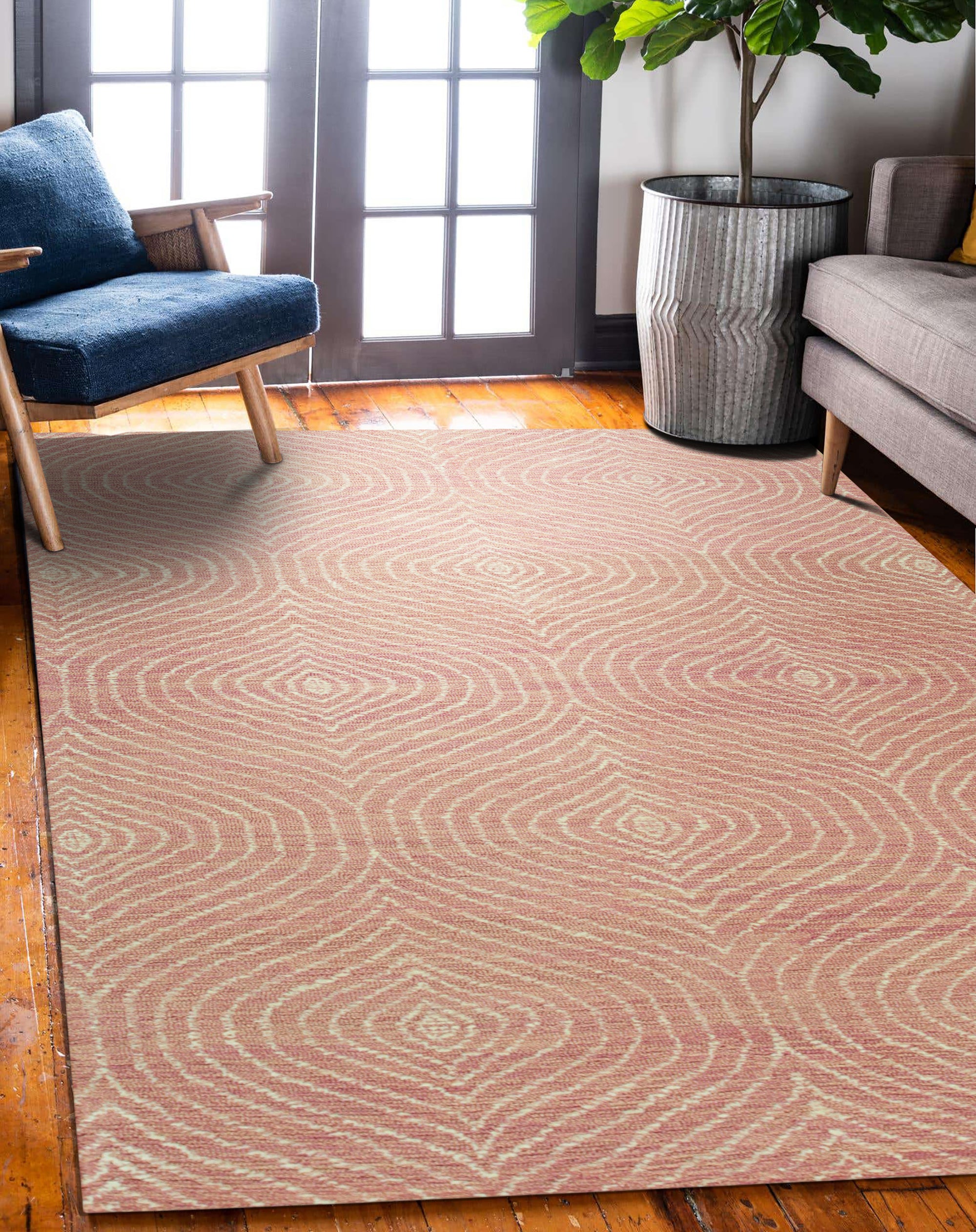 Talia Artistic Pink Hand Tufted Wool Rug, showcasing abstract swirls of blush, rose, and cream against a soft pink backdrop, lending a modern, textural warmth to a bright living space.
